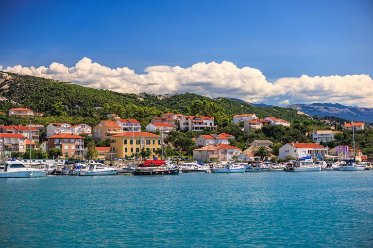 view-on-marina-and-houses-on-the-hill-on-rab-island-croatia-across-the-blue-sea