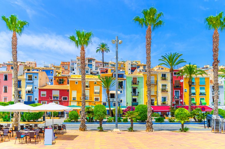 villajoyosa-old-town-embankment-with-typical-colorful-houses-traditional-multicolored-buildings-les-cases-de-colors-street-restaurants-palm-trees-la-vila-joiosa-city-alicante-province-spain