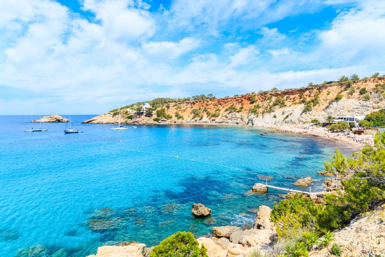 view-of-cala-dhort-bay-with-beautiful-azure-blue-sea-water-ibiza-island-spain